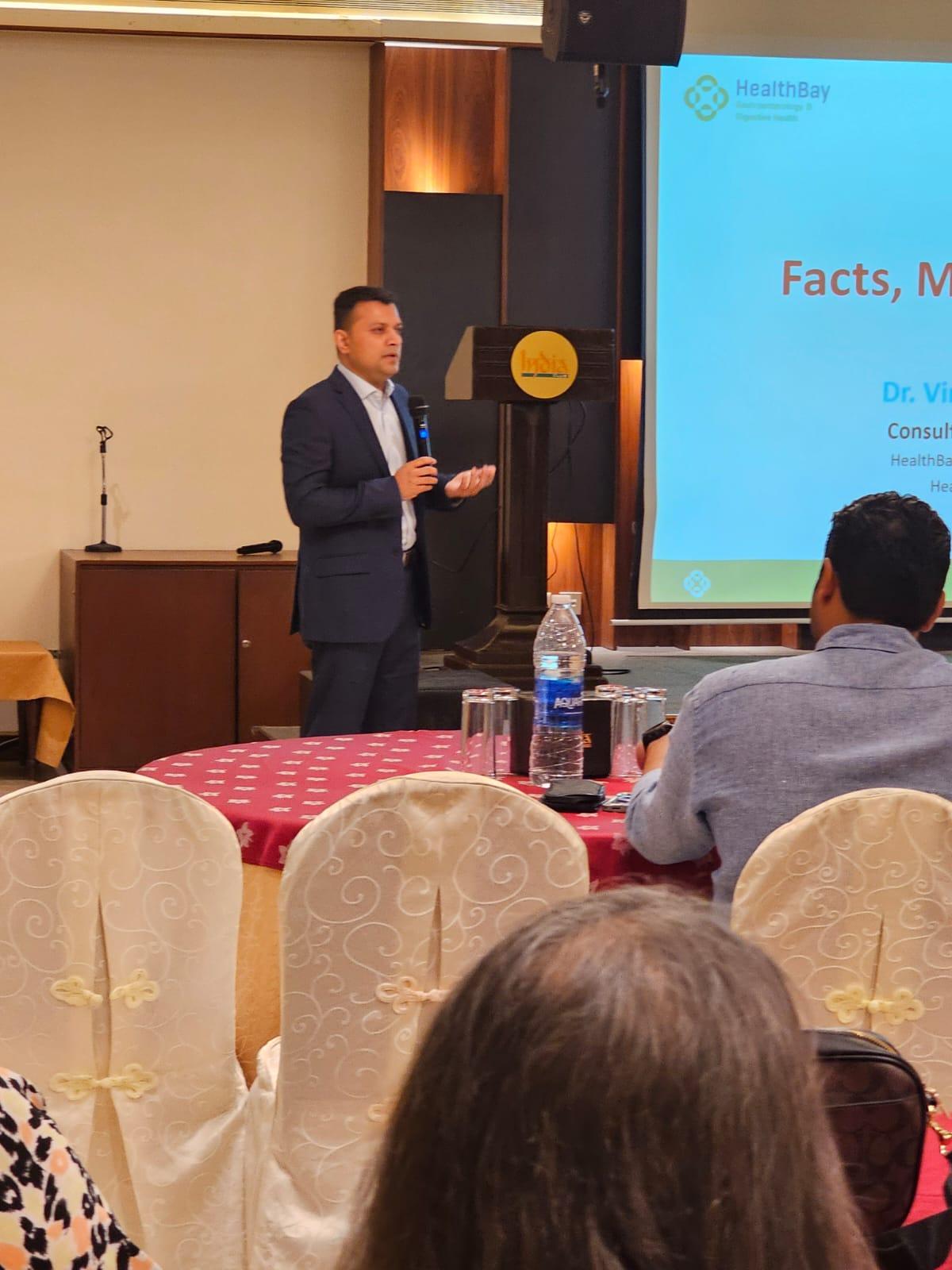 Dr. Vinod Hegade addressing India Club members during his gut health talk in Dubai