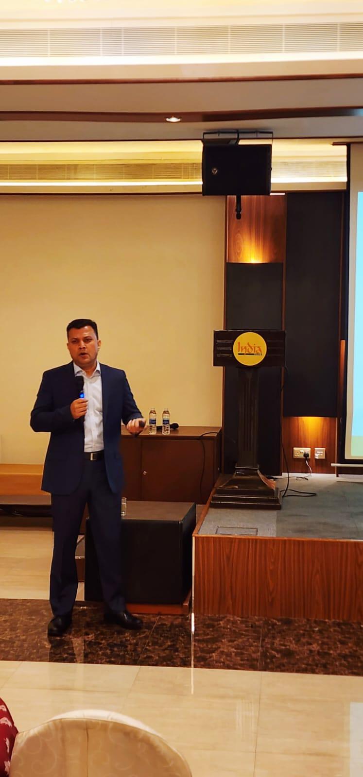 Dr. Vinod Hegade, consultant gastroenterologist, presenting at the India Club, Oud Metha, Dubai