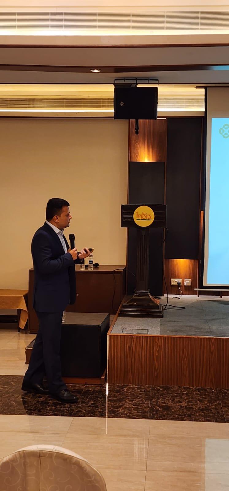 Dr. Vinod Hegade at the podium during a gut health seminar at India Club Dubai