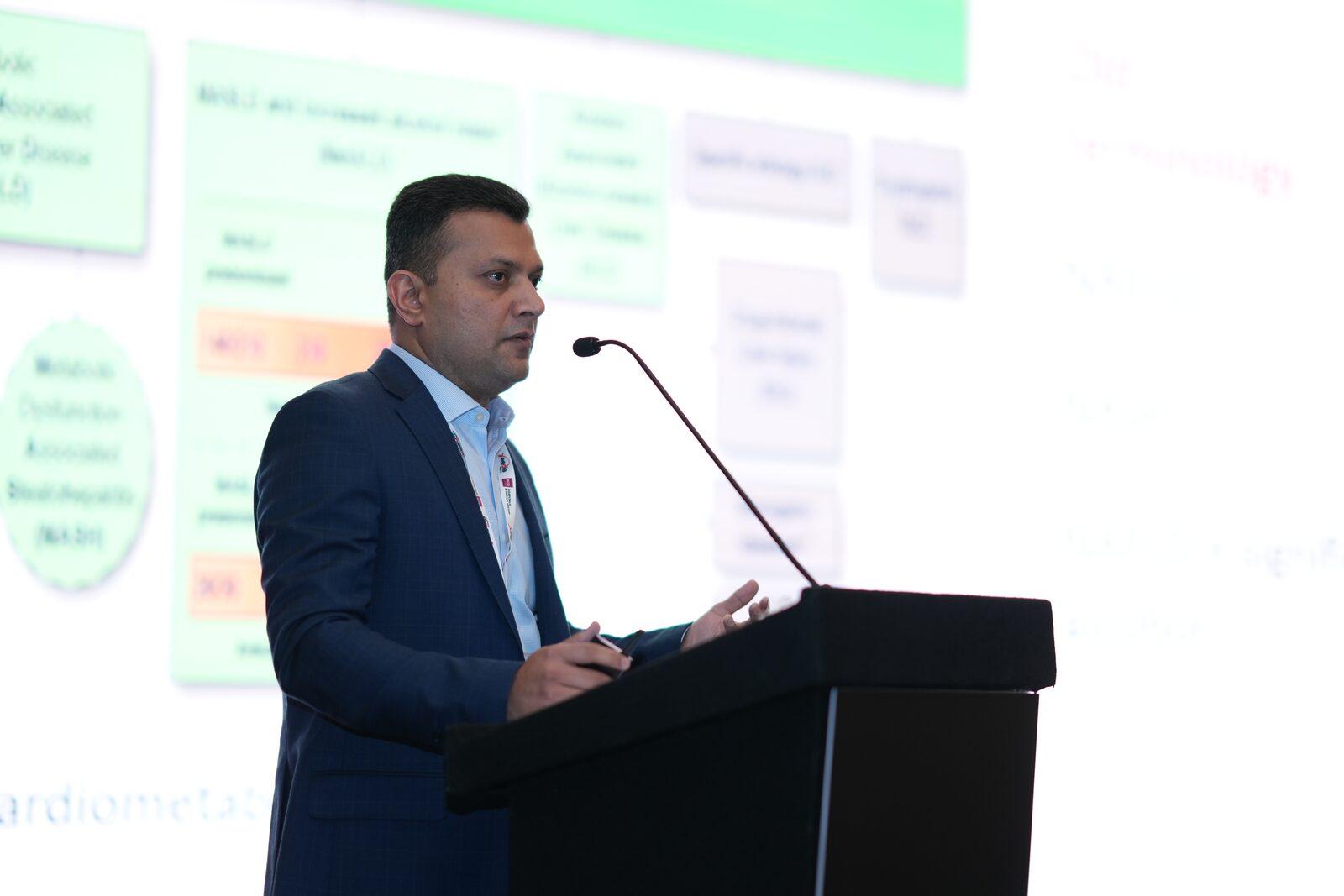Dr. Vinod Hegade presenting on MASLD fatty liver disease at the IMPACT 2026 conference